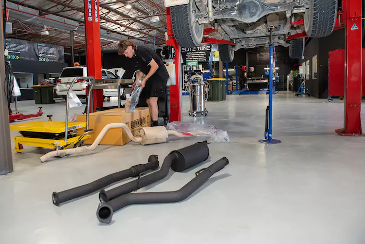 Exhaust systems being installed in our Perth workshop