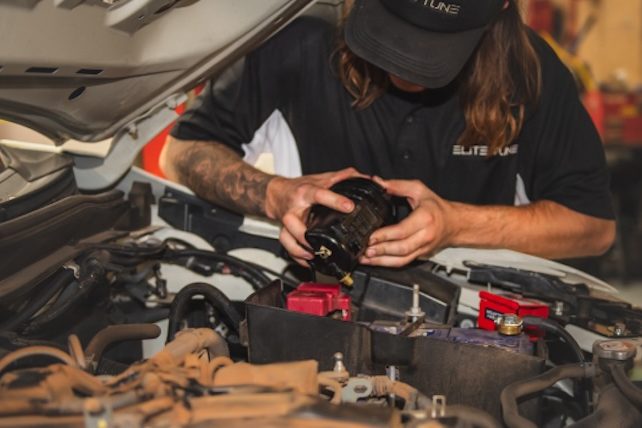 Mechanic showing how to clean diesel injectors